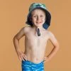 Chapeau Anti UV Bébé Réversible Bleu Et Imprimé Palmiers -Équipement De Surf chapeau anti uv bebe reversible bleu et imprime palmiers